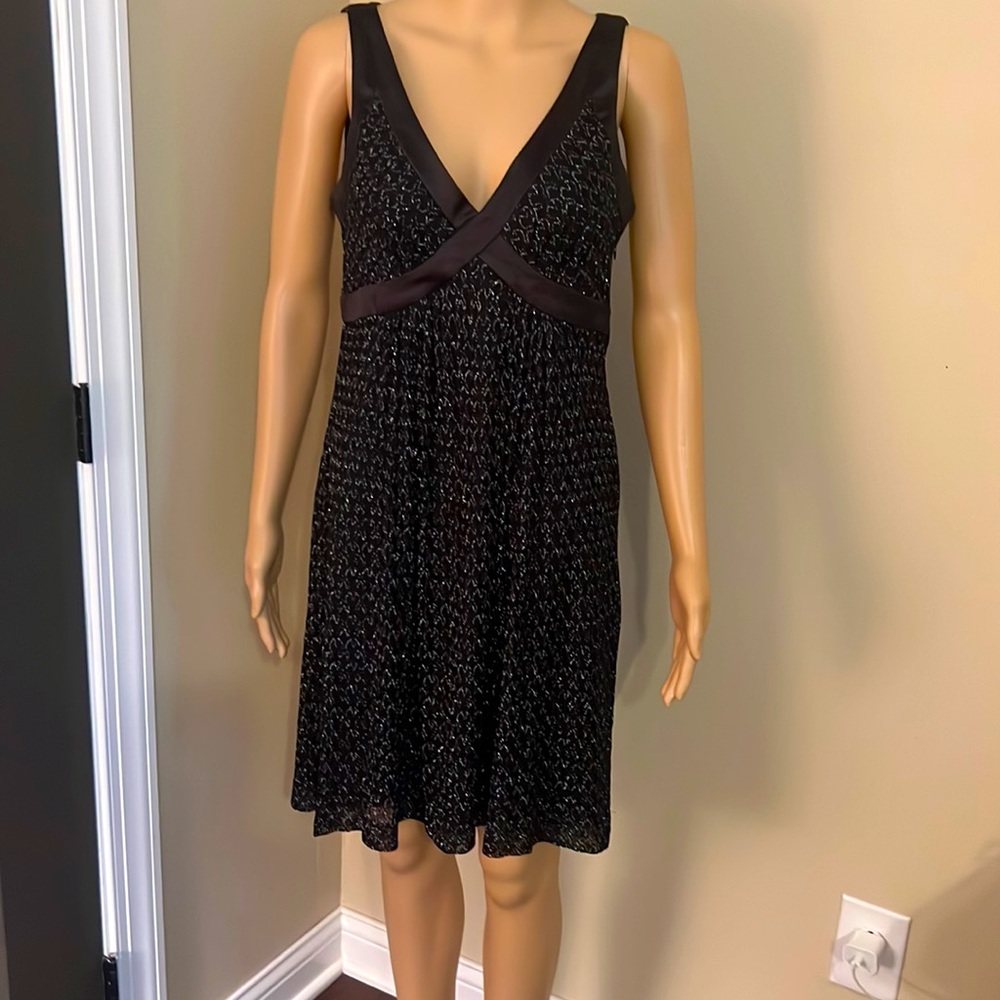 Black/silver metallic-thread sleeveless little black dress.